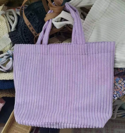 Bossa de compra de dona de pana morada